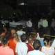 Police and residents examine a car after an explosion went off late on July 21.